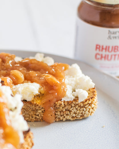Rhubarb chutney on top of feta cheese and seeded sourdough bread slice - Harvest and Wild