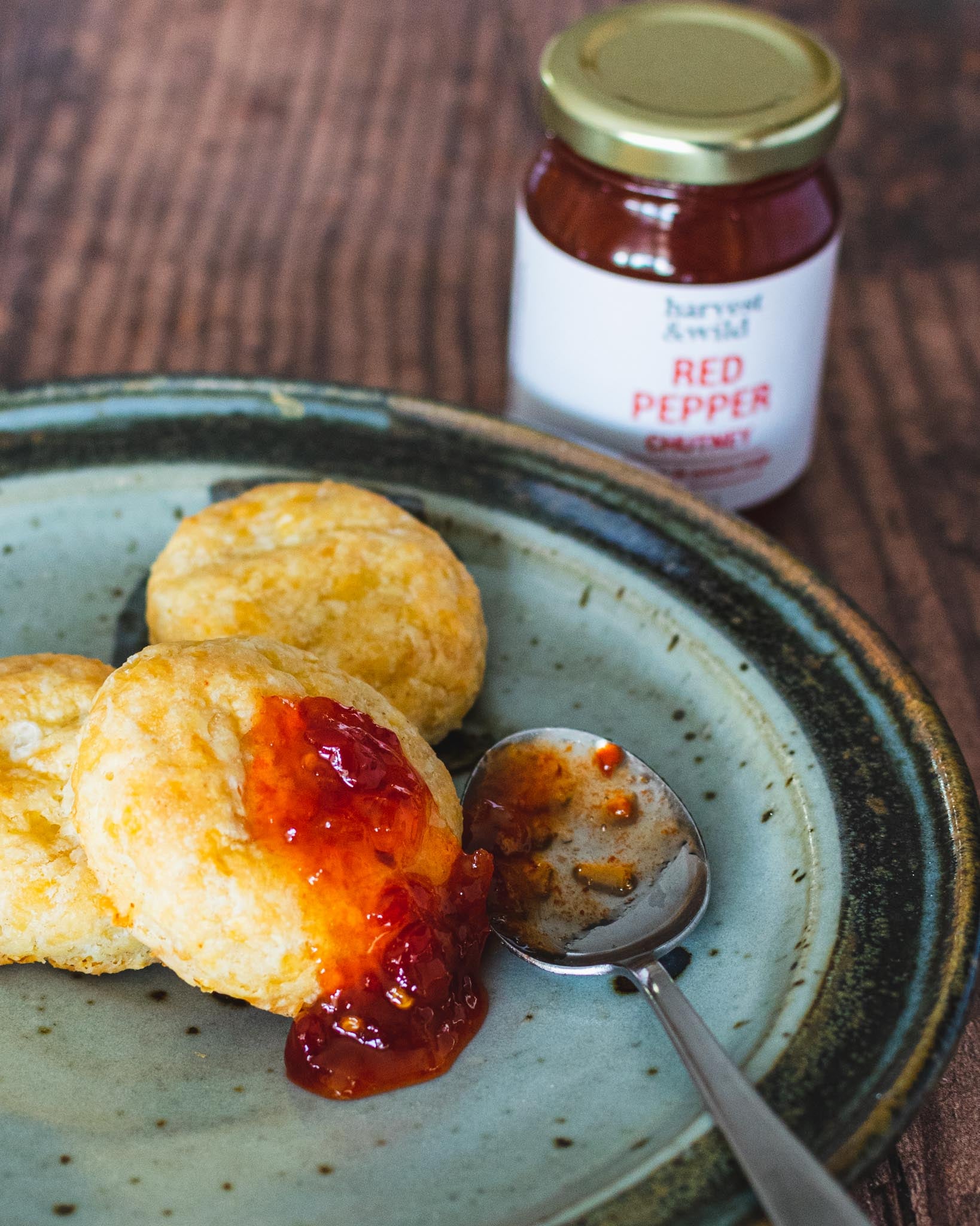 Red pepper chutney on a plate with cheese scones